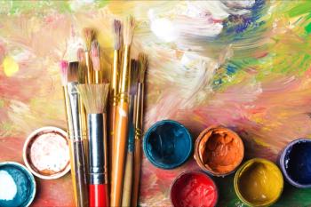 Artist paint brushes and paint cans of paint over bright watercolor background | Image Credit: © BillionPhotos.com - stock.adobe.com