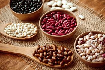 Beautiful multi-colored beans in bowls and wooden spoons on a background of burlap | Image Credit: © mikhail_kayl - stock.adobe.com