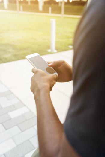man looking at smart phone
