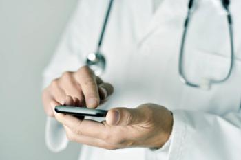 Doctor Checking His Cell Phone