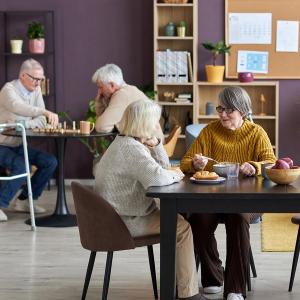 Photo of older adults talking at a community center