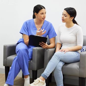 Image of a nurse speaking with a patient