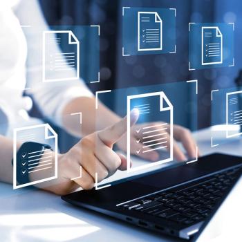 image of a person at a laptop selecting document icons in the air in front of them