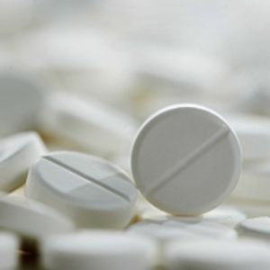 a photo of aspirin as a white tablet