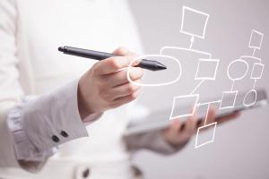 Image of Woman Calculating Data