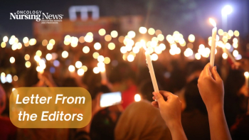 Image of a group of people holding candles at a vigil with lettering that reads "Letter From the Editors"