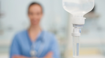 nurse delivers cancer therapy intravenously