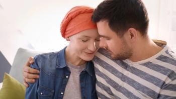 Image of a person wearing a headwrap leaning on a partner
