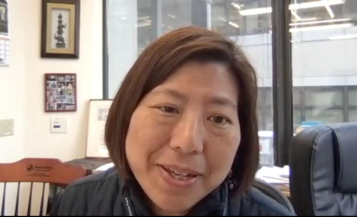 Image of a woman in an office, taken as a screenshot from the video interview