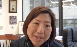 Image of a woman in an office, taken as a screenshot from the video interview