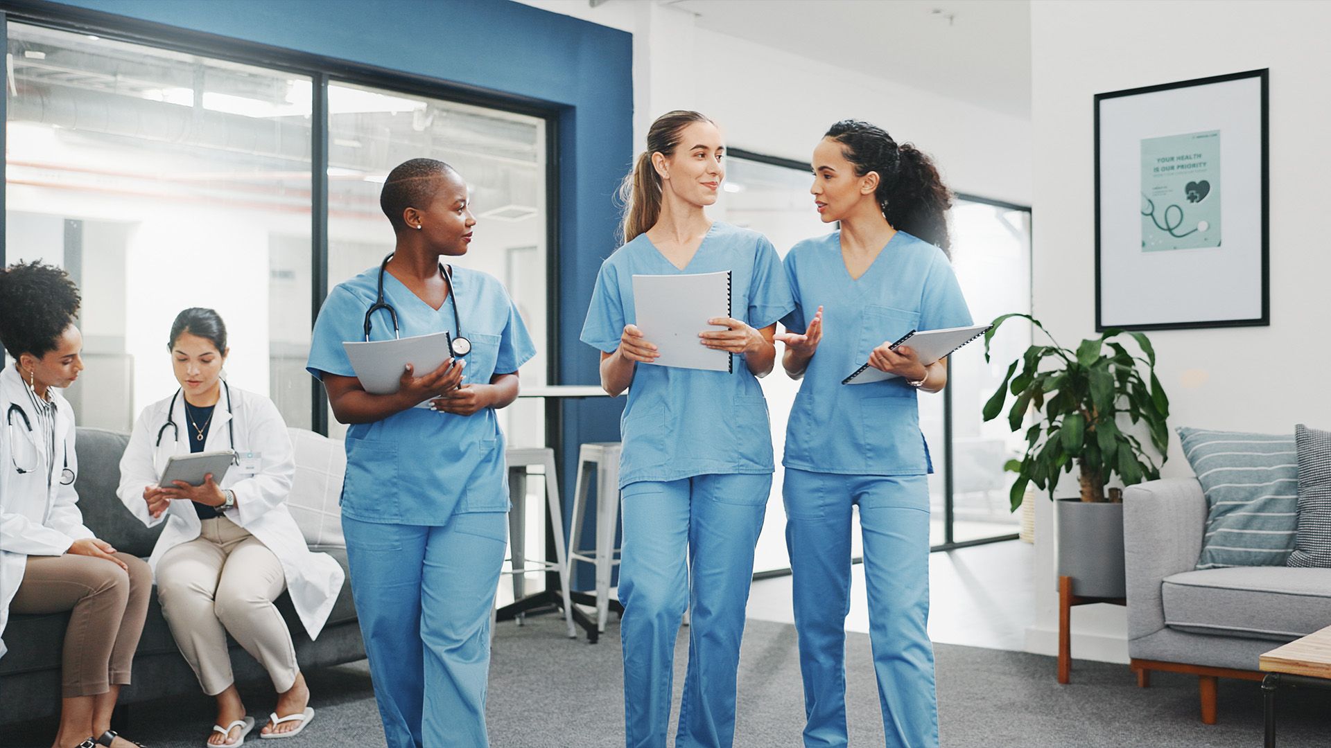 Image of nurses walking and talking together