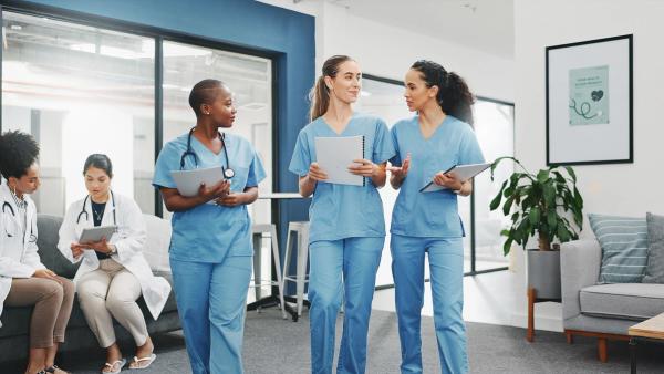Image of nurses walking and talking together