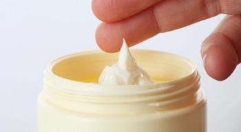 fingers going into a cream jar