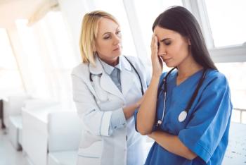 1 nurse comforts another