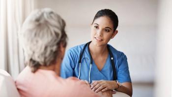 Photo of a nurse talking to a patient