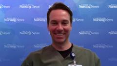 Image of a man wearing scrubs and a name tag in front of a watercolor Oncology Nursing News background
