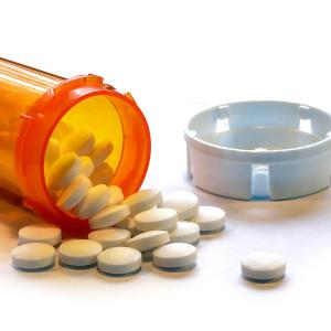 Photo of an open bottle of pills