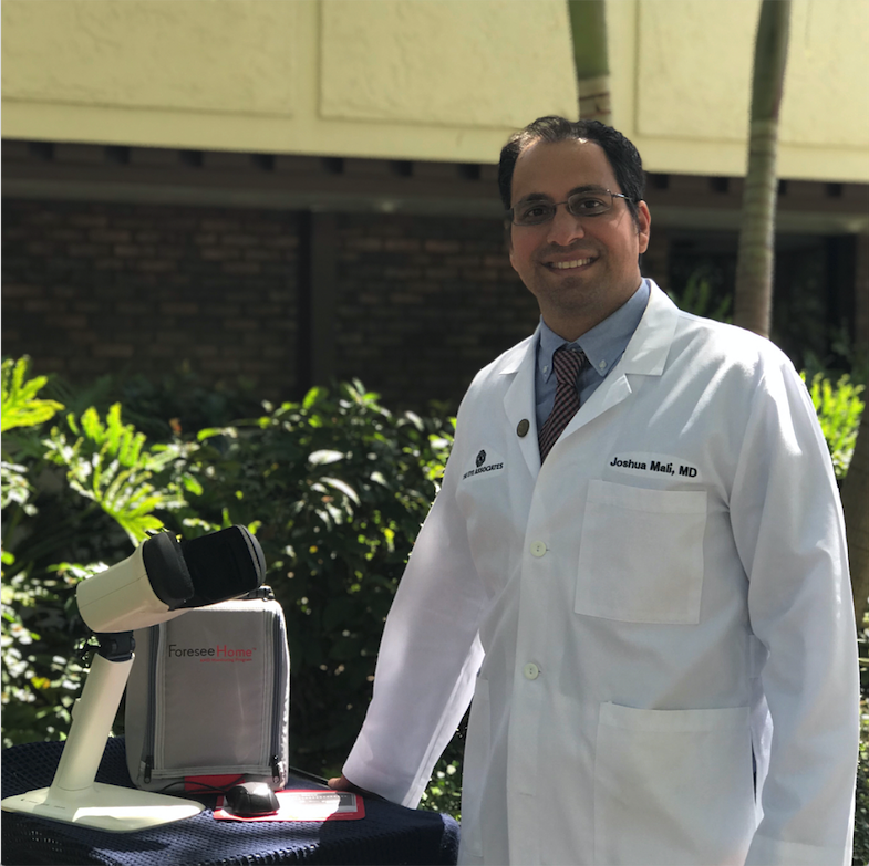 Dr. Mali. pictured here with the AMD monitoring device