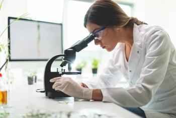 a young female scientist conducting research (Image Credit: AdobeStock/Stock Rocket)