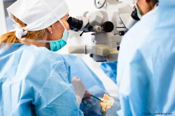 Surgeons perform eye surgery on a patient