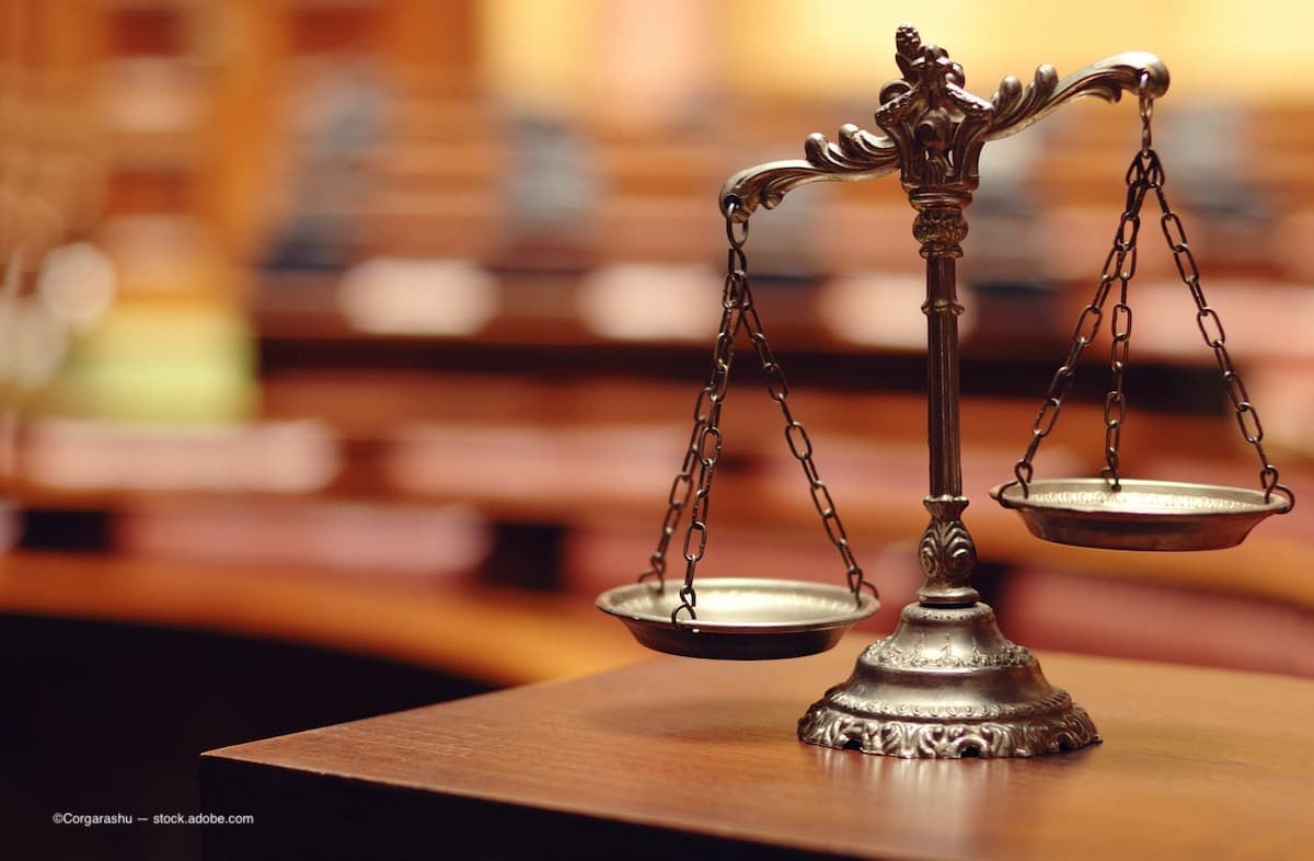 The scales of justice sitting on a table in a courtroom