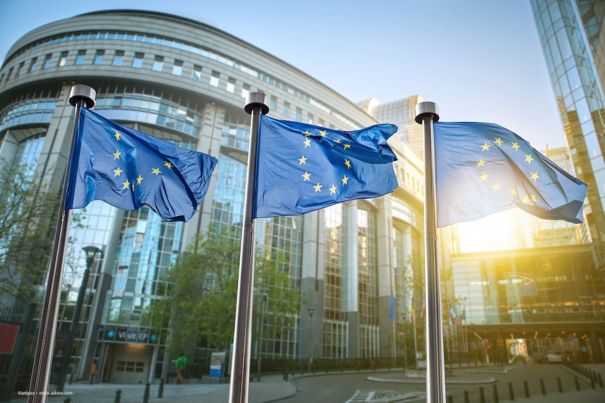 European Union flags outside a parliament building. Concept image for European Commission approval and European Medicines Agency regulatory decision on aflibercept biosimilar Mynzepli. Image credit: ©artjazz – stock.adobe.com
