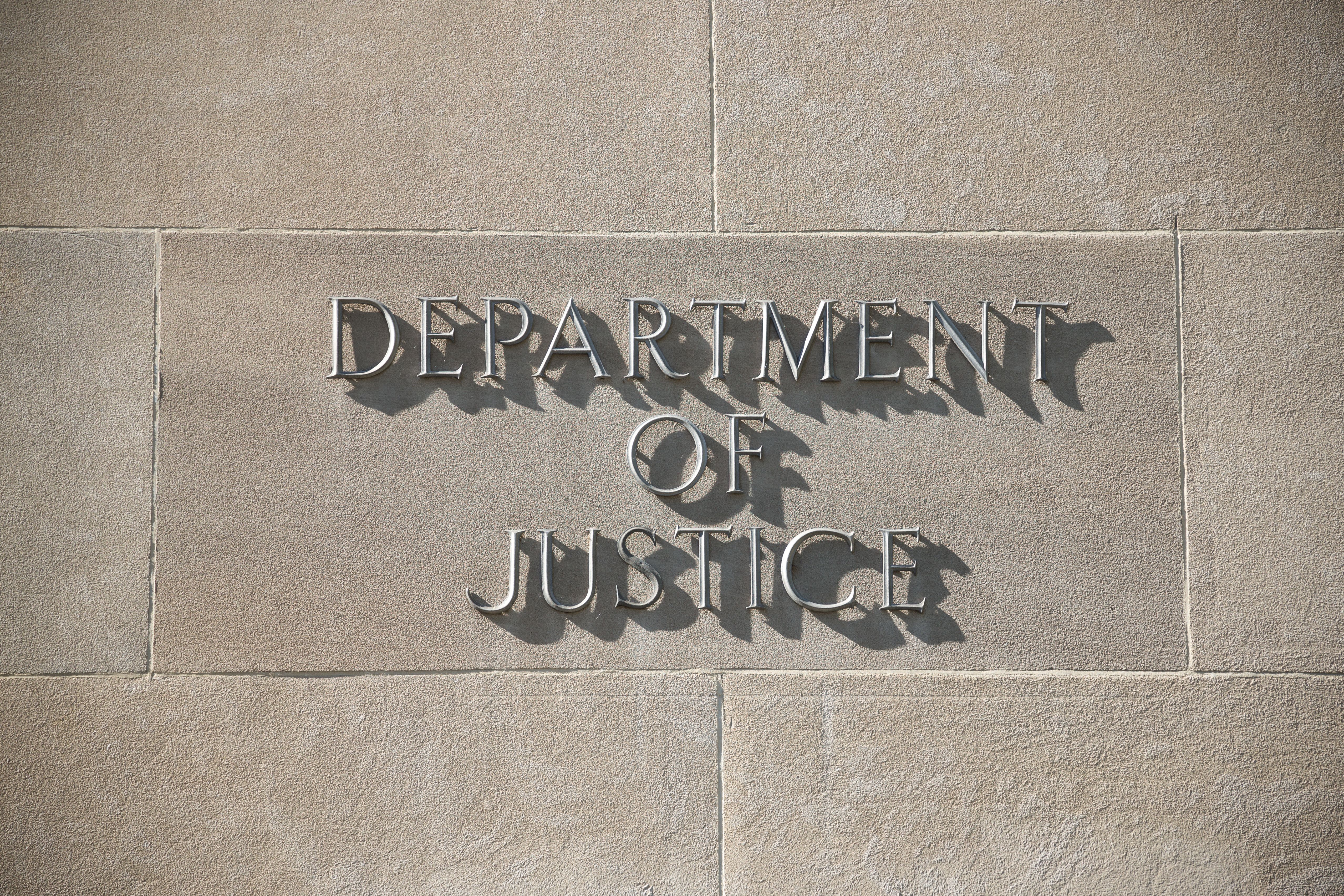 Photo of the outside sign of the Department of Justice