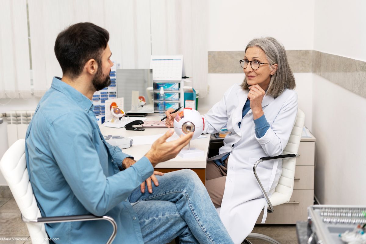 A man undergoes evaluation in an ophthalmologist's office for uveitis. Concept image for uveitis research United Kingdom England Europe posterior and anterior eye ocular infection. Image credit: ©Maria Vitkovska – stock.adobe.com