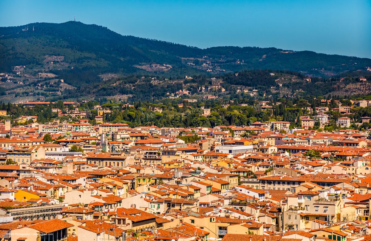 The historic centre of Florence, Italy, surrounded by rolling green hills. Image credit: ©H-AB Photography – stock.adobe.com