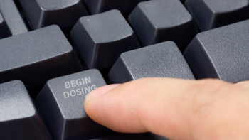 A finger presses a button on a keyboard, which reads "Begin Dosing." Concept image for clinical trial start, SparingVision NYRVANA trial for retinitis pigmentosa. Image credit: ©joxxxxjo from Getty Images, via Canva.