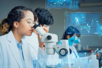 Scientists work in a lab, looking at microscopes while data is superimposed over the top of the photo. Concept image for clinical trial research and structural functional endpoints in ophthalmology. Image credit: ©metamorworks – stock.adobe.com