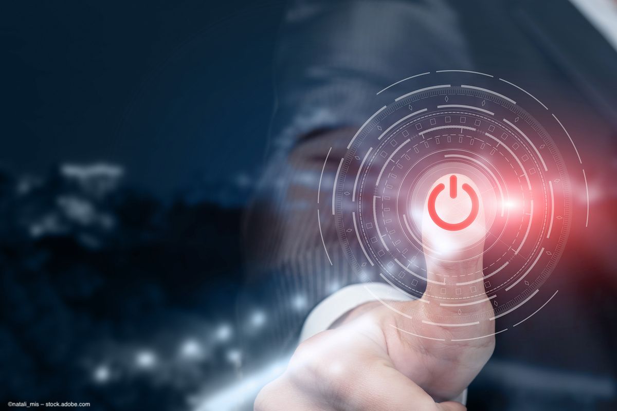 An image of a person pressing a computer shutdown button, superimposed digitally over the image. Concept for clinical trial discontinuation. Image credit: ©natali_mis – stock.adobe.com