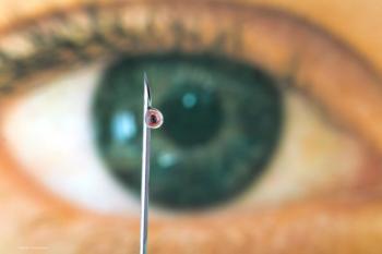 A close-up of an eyeball looking at the tip of a syringe needle. There is a droplet of liquid coming from the syringe. Concept image for anti-VEGF and diabetic macular oedema. Image credit: ©kikkerdirk – stock.adobe.com