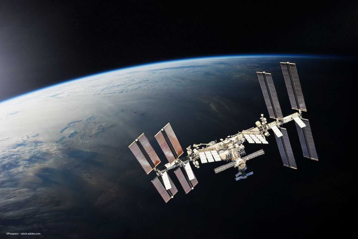 The International Space Station (ISS) pictured in orbit above Earth. Concept image for International Spectralis Symposium conference meeting in Heidelberg, Germany, and NASA. ©Paopano – stock.adobe.com
