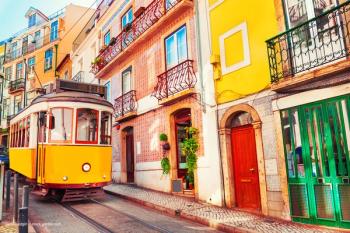 A trolley train car in Lisbon, Portugal. Concept image for the European Society of Ophthalmology SOE meeting in Lisbon, historic Belem, Tagus River. Conference agenda schedule and meeting information. Image credit: ©smallredgirl – stock.adobe.com