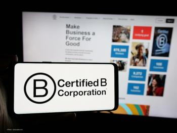 The B Corp certification symbol on a phone, and the B Lab website on a computer. Image credit: ©Timon – stock.adobe.com