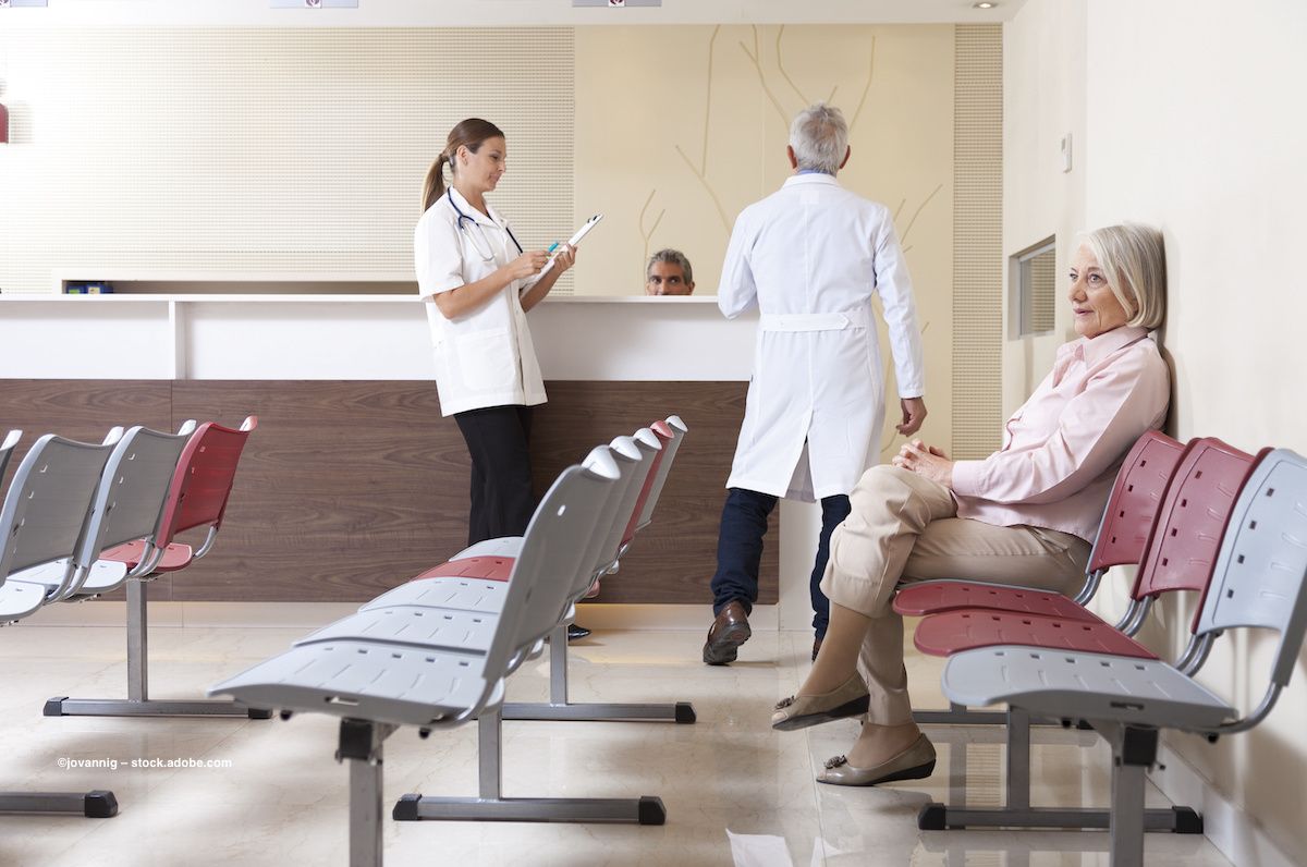 Patients check in at a doctor's office waiting room. Image credit: ©jovannig – stock.adobe.com