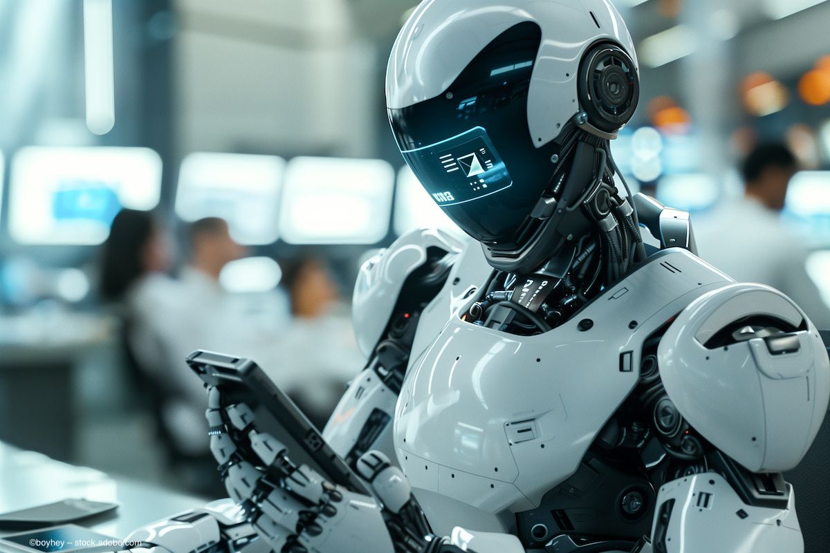 A humanoid robot texts on a phone. Image credit: ©boyhey – stock.adobe.com