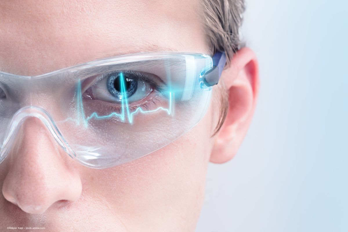 A doctor assesses ECG readouts displayed on screen in a pair of futuristic glasses. Image credit: ©Štěpán Kápl – stock.adobe.com