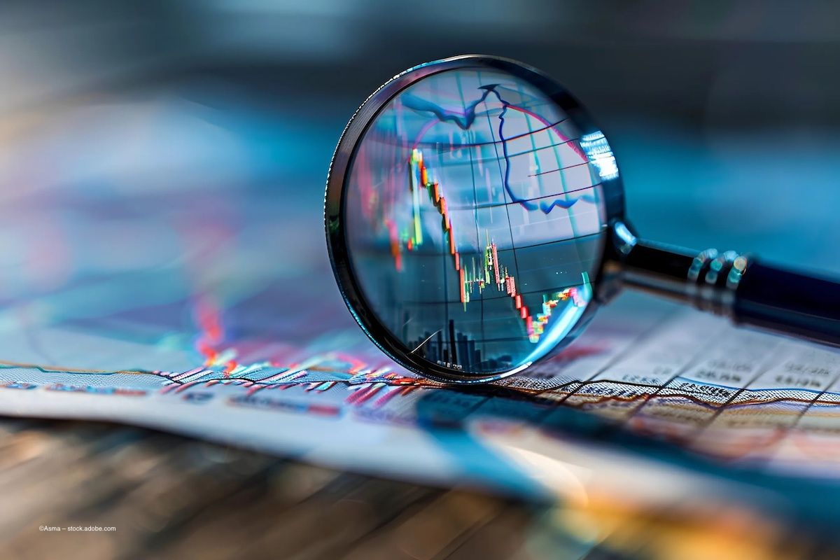 A magnifying glass enhances stocks on a chart. Concept image for global commercialisation agreement, pharmaceutical distribution in eastern and western hemispheres, Europe and EMEA. Image credit: ©Asma – stock.adobe.com