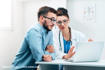 A physician supervises a student in a clinical setting. Image Credit: ©Suteren Studio – stock.adobe.com