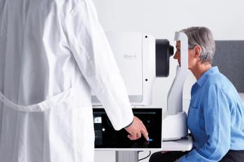 A physician helps a patient undergo microperimetry imaging with the iCare MAIA. Image courtesy of iCare.