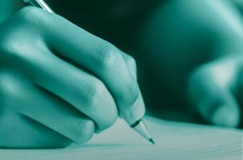 A hand, holding a pencil, marks a test paper. Image credit: ©MP Studio - stock.adobe.com