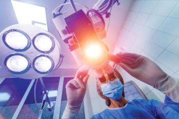 Ophthalmologist adjusting and aiming surgical lights