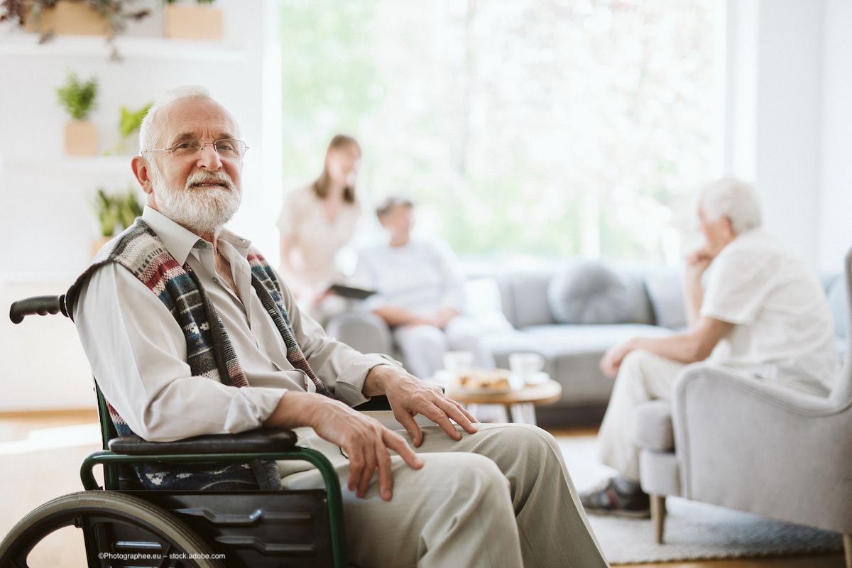 An older man with glasses sits in a wheelchair. Concept image for cabozantinib and corneal perforation, ocular adverse effects, vascular endothelial growth factor VEGF tyrosine kinase inhibitor TKI. Image credit: ©Photographee.eu – stock.adobe.com