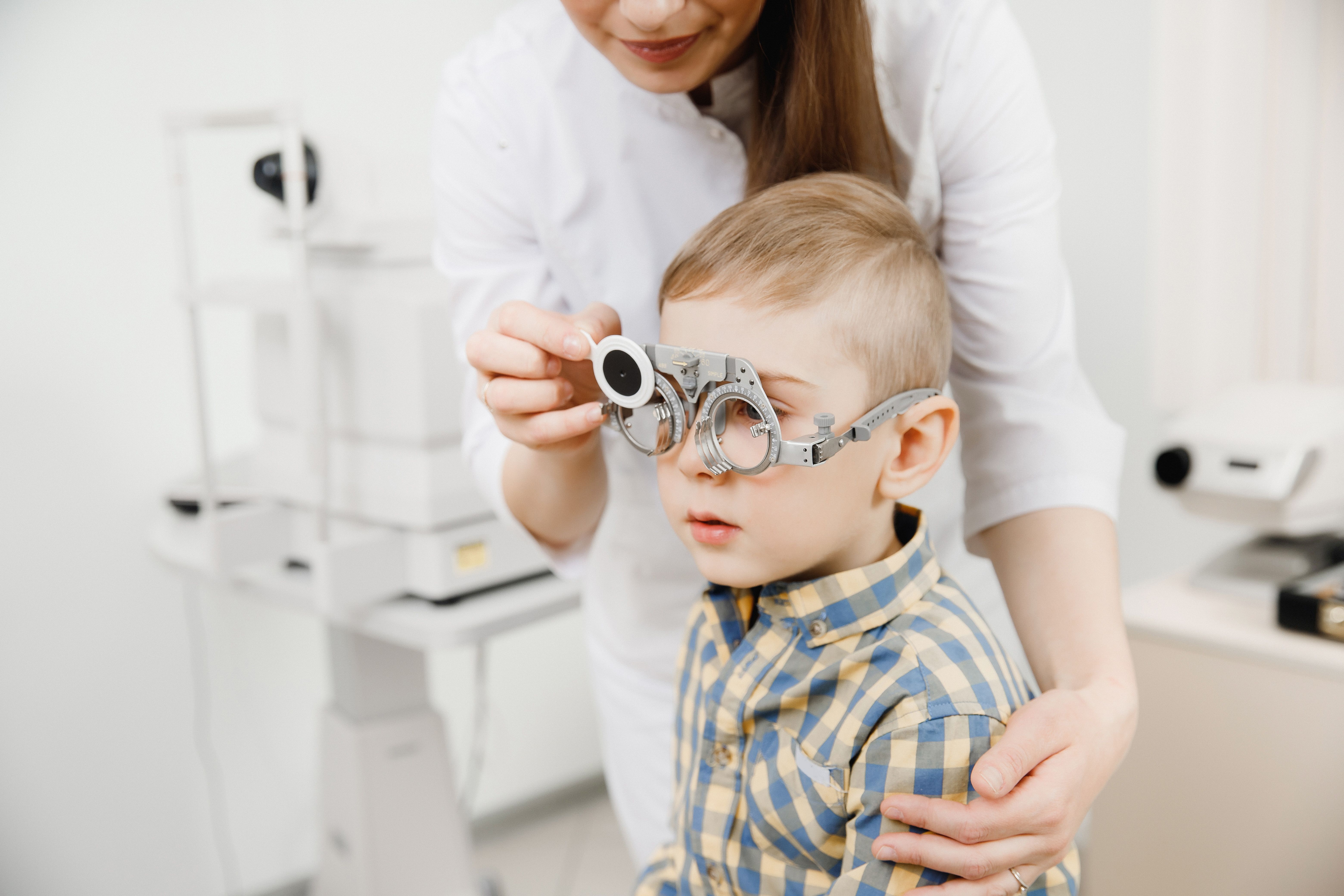 little boy getting eye exam