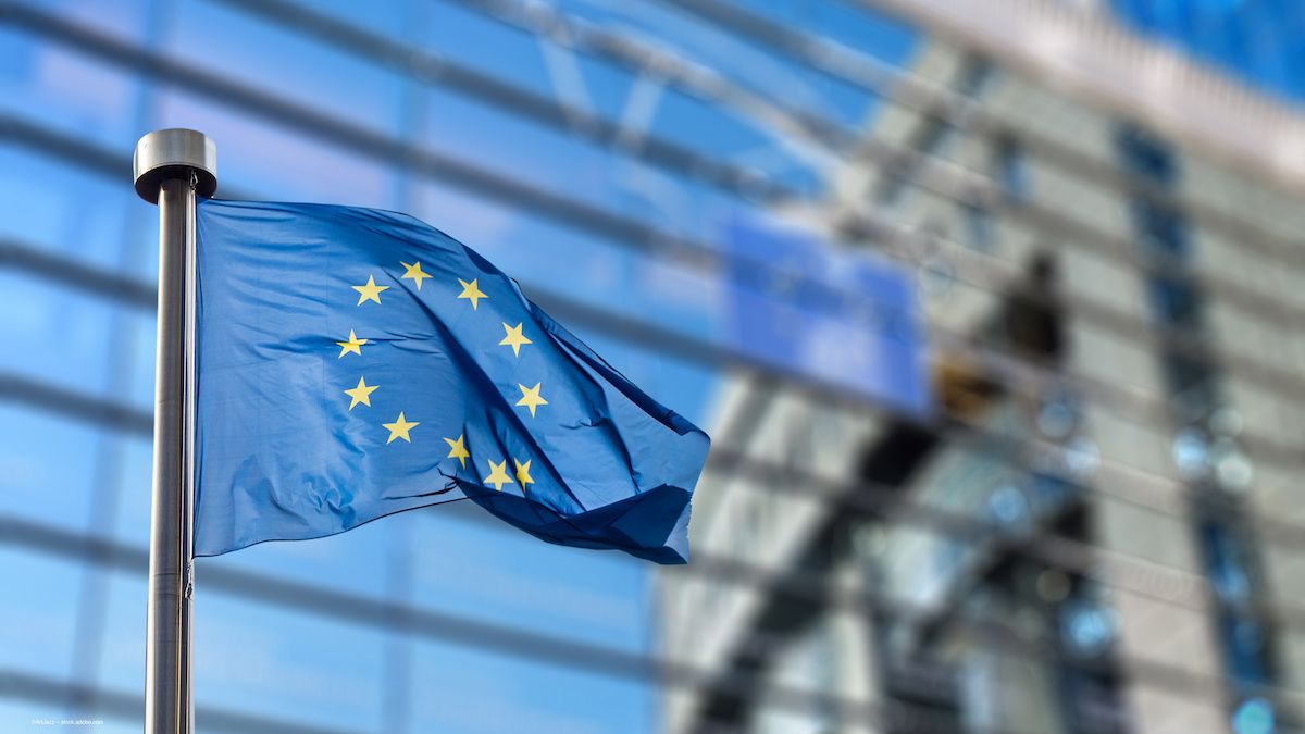 A flag for the European Union outside a government building. Image credit: ©ArtJazz – stock.adobe.com