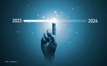 A person's hand moves a sliding counter from 2023 to 2024. Image credit: ©Dilok – stock.adobe.com