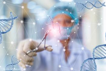 A scientist looks at genetic data in a lab. Image credit: ©natali_mis – stock.adobe.com