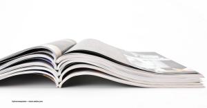 An academic journal laid open on its spine. Image credit: ©johannesspreter – stock.adobe.com